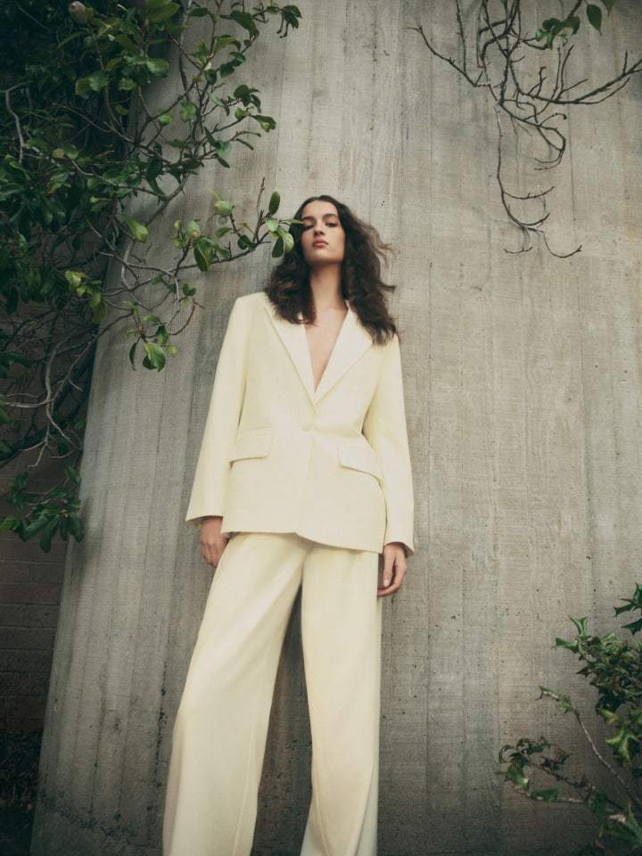 Woman wearing the lemon oversized single breasted blazer and lemon tailored pant