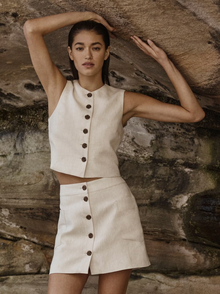 Woman in tuck detail mini dress and savannah heel